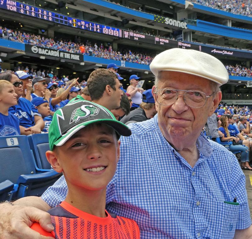 Ben and grandpa at a Blue Jays game